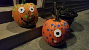 pumpkins decorated with foam stickers